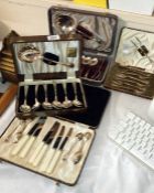 4 boxes of spoons fish vaults/ knives etc