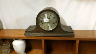 A 1930's oak mantle clock