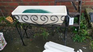 A wrought iron planter