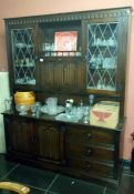 A dark wood wall display cabinet