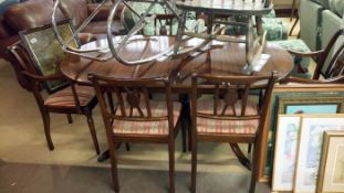 A dining table with 4 chairs & 2 carvers