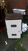 A small 2 drawer filing cabinet