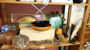 A shelf of wooden items & clocks