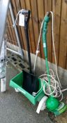 A garden strimmer, spade & 1 other item