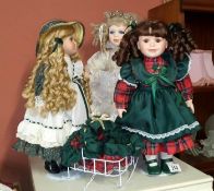 A porcelain doll on chair & 2 others