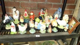 A shelf of roosters & chickens etc.