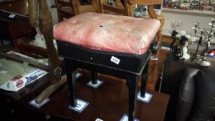 An old adjustable piano stool