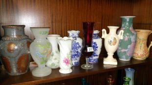 A quantity of china, glass & pottery vases