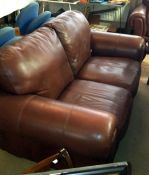 A 2 seater brown leather sofa