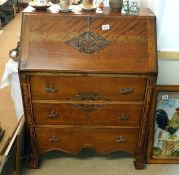 A carved bureau