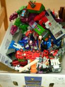 A large box of Transformer toys etc.