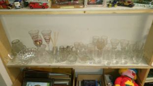 A shelf of glass etc.