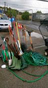 A quantity of garden tools including hose & wellington boots etc.