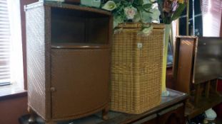 A Lloyd loom style bathroom cabinet & linen bin