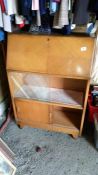 A bureau with sliding glass doors