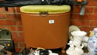 A Lloyd loom style linen bin