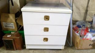 A 3 drawer white bedside chest