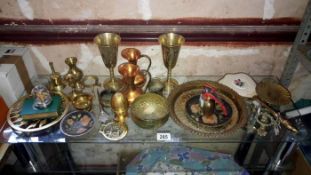 A shelf of brass items