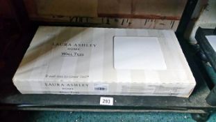 An unused box of Laura Ashley wall tiles