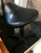 A saddle style office chair