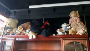 A quantity of Teddies, dogs & a doll etc.