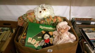 A box of miscellaneous dolls & games