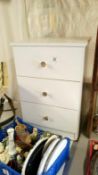 A 3 drawer white bedside cupboard