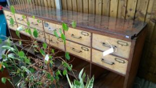 A 12 drawer wooden unit