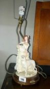 A table lamp with figure of a girl & dog