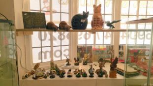 2 shelves of bird figures & wooden cats etc