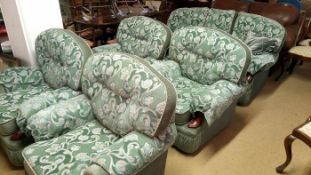A green patterned 5 piece suite