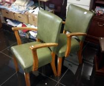 A pair of leather & wooden chairs