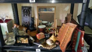 A shelf of wooden items etc.