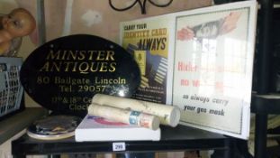 A shelf of interesting items including antique sign