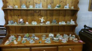 A large collection of Lilliput lane cottages