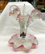 A Victorian cranberry and overlaid white glass epergne,