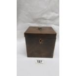 An early 19th century mahogany tea caddy