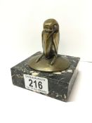 An unusual bronze of a bird on a marble base,