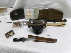 A bayonet, one other knife, army & RAF caps with badges,