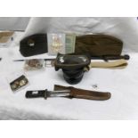 A bayonet, one other knife, army & RAF caps with badges,