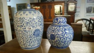 2 large blue and white lidded jars