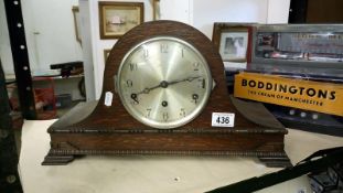 A wooden mantel clock