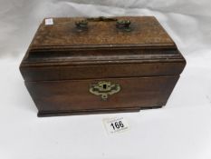 A wooden casket with brass fittings,