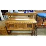 A carved oak sideboard