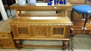 A carved oak sideboard