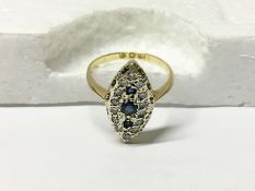 A marquis shaped 18ct gold sapphire and diamond ring,