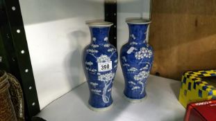 A pair of blue and white vases,