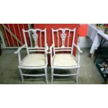 A pair of shabby chic painted Edwardian carver chairs
