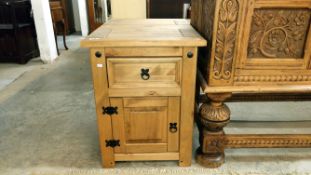 A pair of pine bedside cabinets