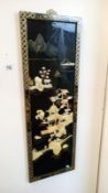 An oriental lacquered wall hanging